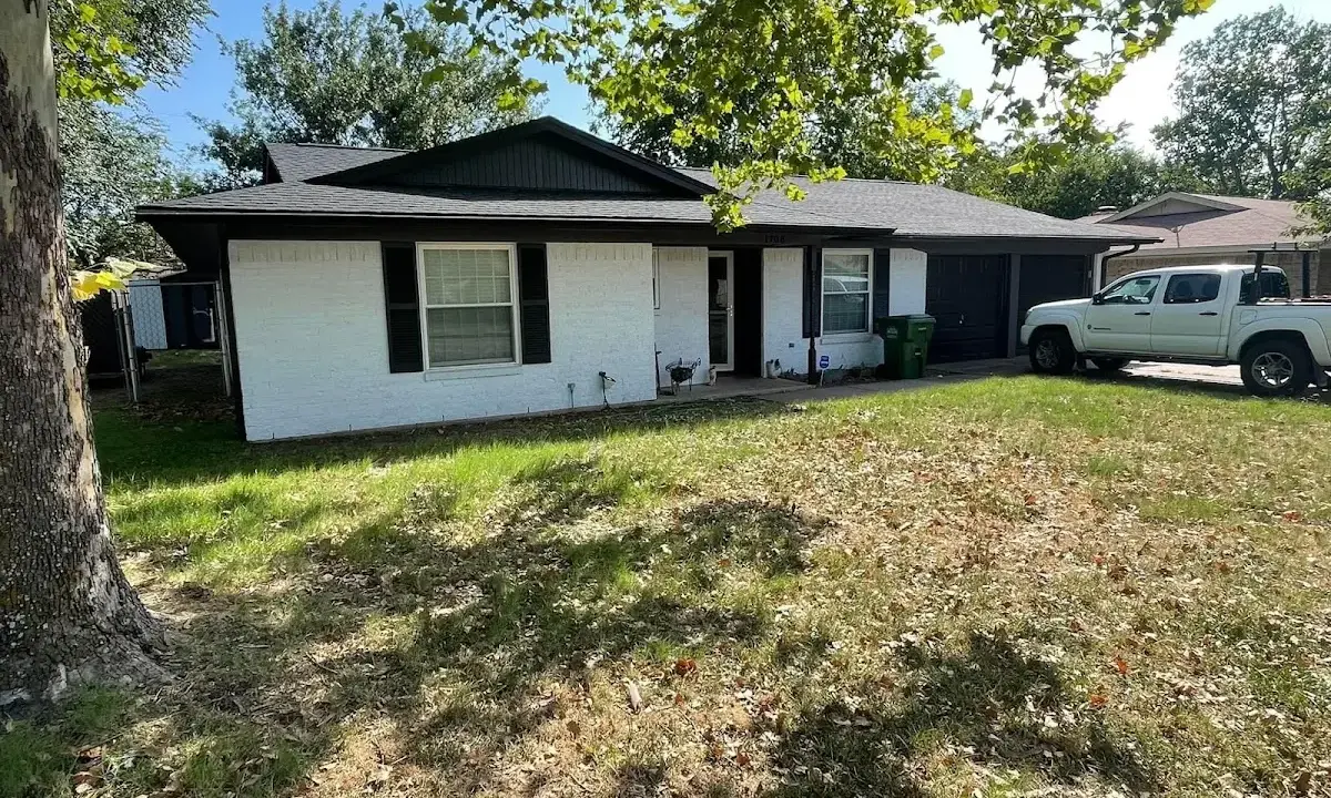 Professional roofing crew working on a residential roof in El Cerro Mission